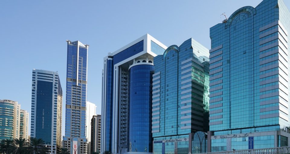 global-business-development---a-group-of-tall-buildings-sitting-next-to-each-other