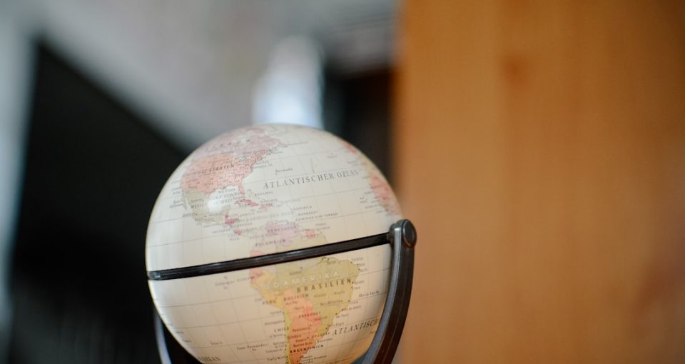 white-and-brown-desk-globe---cross-border-mentorship